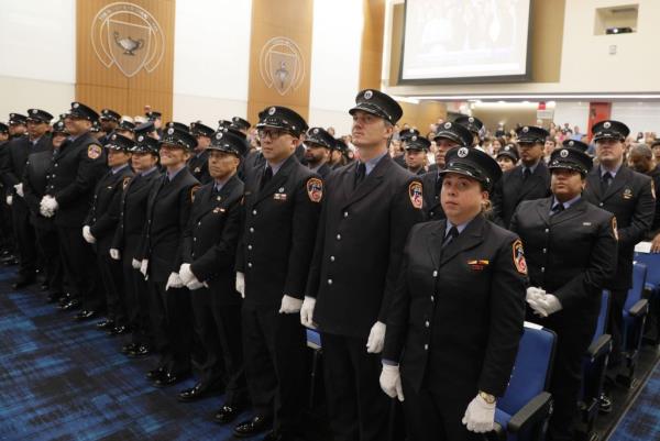 FDNY EMS lieutenants stand at a promotion ceremony.