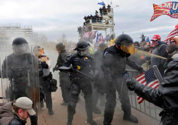 Trump supporters clash with police and security forces as they stormed the US Capitol on January 6, 2021.