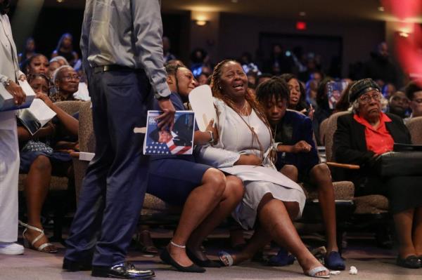 Chantemekki Fortson, mother Roger Fortson, and other family members, mourn him during the funeral service in Stonecrest, Georgia on May 17, 2024.