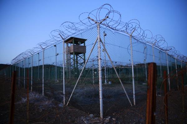 Chain l<em></em>ink fence and co<em></em>ncertina wire surrounds a deserted guard tower within Joint Task Force Guantanamo's Camp Delta at the U.S. Naval ba<em></em>se in Guantanamo Bay, Cuba